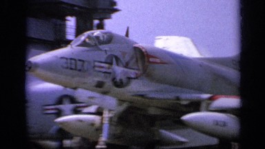 1962: united states navy plane about to take off on an aircraft carrier in front