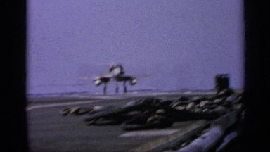 1962: a fighter jet landing on what appears to be an aircraft carrier ITALY