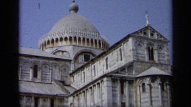 1962: crowd mills around on the lawn of an extravagant building. ITALY