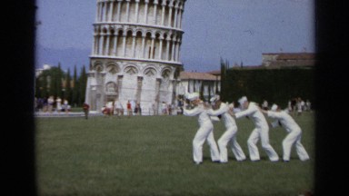 1962: navy servicemen posing with the leaning tower of pisa in italy. ITALY