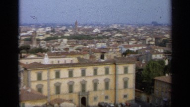 1962: a sprawling city with many whitewashed buildings lies at the base