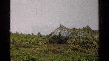 1952: grass field with a camouflaged area JAPAN
