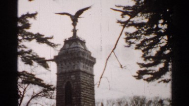1952: Statue in the Middle of the Garden with People Walking Behind It Japan