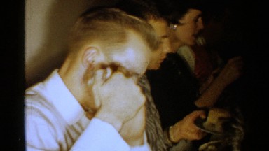 1952: there is a party consisting of some peoples enjoying in dinner