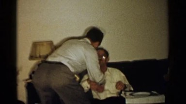 1952: two men which appear to be friends sharing a kiss with their lips