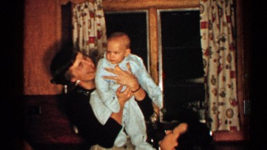 1952: mother shows adorable baby boy off to the camera. NEW HAMPSHIRE
