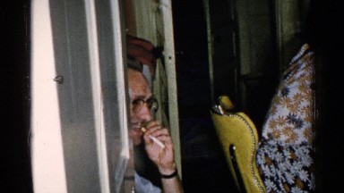 1952: family enjoying each other's company at home around the dinner table.