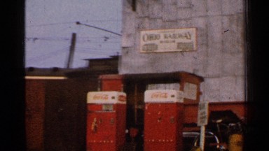 1953: coca-cola refrigerators in front of sign reading ohio railway, trains