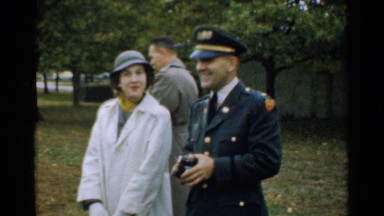 1952: an officer stands next to a couple who are smiling in a park NEW HAMPSHIRE