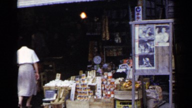 1953: a local store in afternoon time, woman is entering the store JAPAN