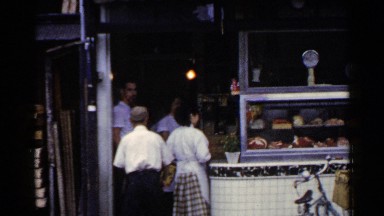 1953: lady is at shop for purchasing some foods JAPAN