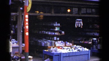 1953: a local market located next to a street with all the goods
