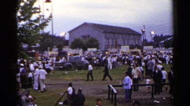1953: a bunch of people gathered in the middle of the town, celebrating