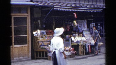 1953: very few people are walking at the bazaar at the morning time