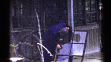 1953: a worker busy polishing a window frame at a metal fabrication unit