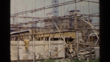 1953: jumbled looking construction site, chinese sign on a nearby building JAPAN