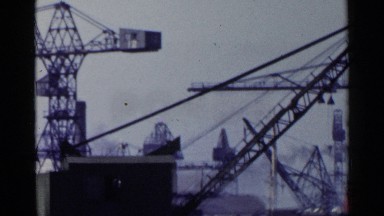 1953: The View of a Crowded Dock with a Man Walking Down a Pier, Japan