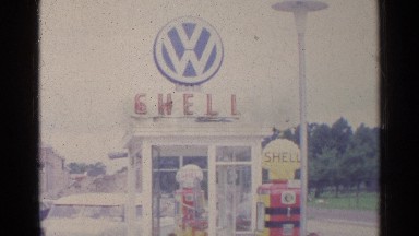 1961: Man Entering Shop at Entrance on Sunny Morning in Germany