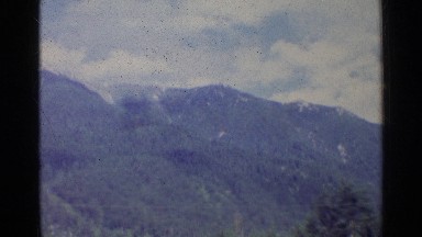 1961: mountain with full of grass and also sky with clouds