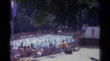 1961: people gathered around swimming pool GERMANY