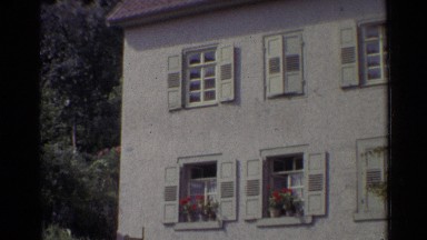 1961: apartment complex with flowers on the window seal. GERMANY