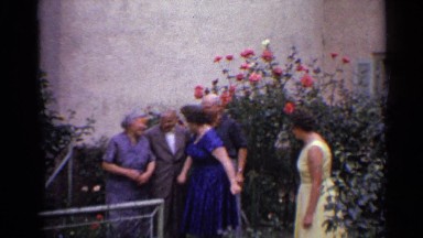 1961: group photos of family members in a flower garden GERMANY