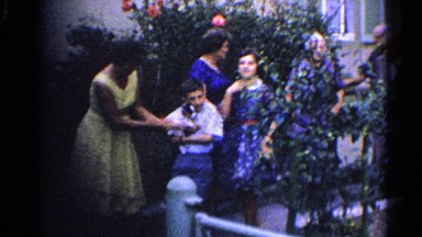 1961: family is in the garden, boy hold a cat in his hand GERMANY