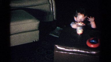 1963: a funny and cute kid throwing everything placed on the top of stool