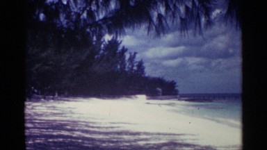 1963: peoples are enjoying their summer vacation in beach . NASSAU BAHAMAS