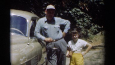 1949: the girl standing with her father near to their vehicle NEW ORLEANS