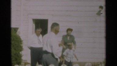 1949: a family standing outside talking NEW ORLEANS LOUSIANA