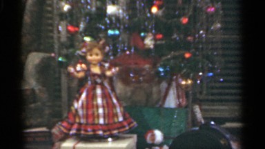 1949: a doll and christmas tree in front of a window. SANTA CRUZ CALIFORNIA
