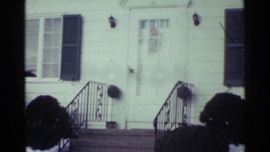 1959: front entrance of a house with snow covered lawn. OHIO