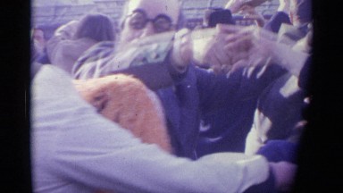 1961: A Group of Mature Couples Playfully Dance Outside in the Cold Spain