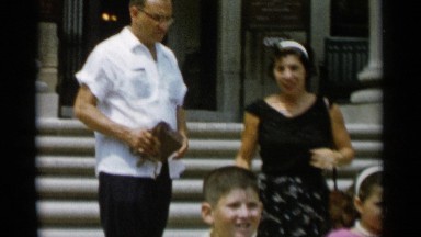 1956: a family is coming out from the building, happy and enjoying JONES BEACH