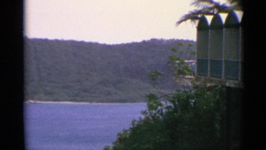 1967: a large pavilion on the bank of a river flowing through a valley US VIRGIN