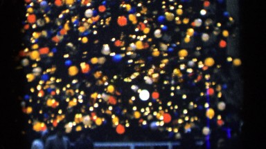 1955: happy lights brighten the town christmas tree. NEW YORK CITY