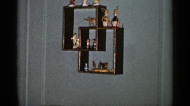 1955: an older, well dressed woman sitting in a beautiful, ornate gold chair
