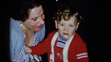 1955: a woman trying to kiss her child NEW YORK CITY