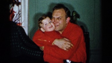 1955: a man holding child hardly and kissing him with a lot of love NEW YORK