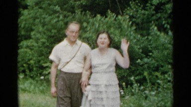 1954: a couple wave and kiss in a tropical setting NEW YORK