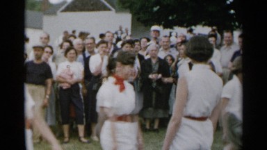 1954: girls are walking two sides and doing exercise or sports events with fun.