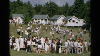 1954: a lot of people are grouped together to celebrate something