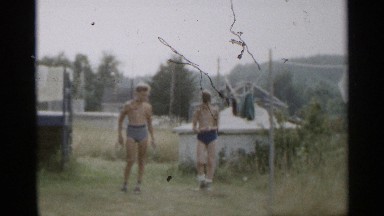 1954: Two Boys Playing Horseshoes in Underwear in New York Backyard