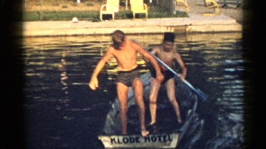 1954: the two boys standing on the boat with their stick NEW YORK