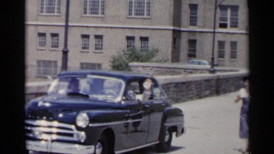1954: man giving hand signal while driving a car. NEW YORK