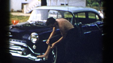 1954: a person is standing near the tree NEW YORK
