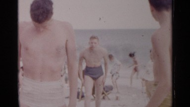 1954: adolescent boys at the beach horsing around and having fun NEW YORK