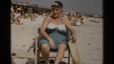 1954: Old Lady Relaxing at Seashore New York