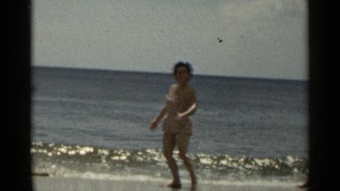 1954: the women are playing on the seashore with water NEW YORK